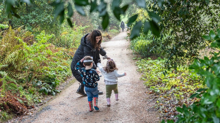 Visitors in the garden in winter at Powis Castle, Wales